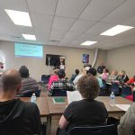 Intergenerational Tech Inc. Founder Kem Delaney-Ellis preparing to present a Google Data Analytics Certification instruction session at the Kentucky Career Center.